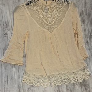 Cream colored lace blouse